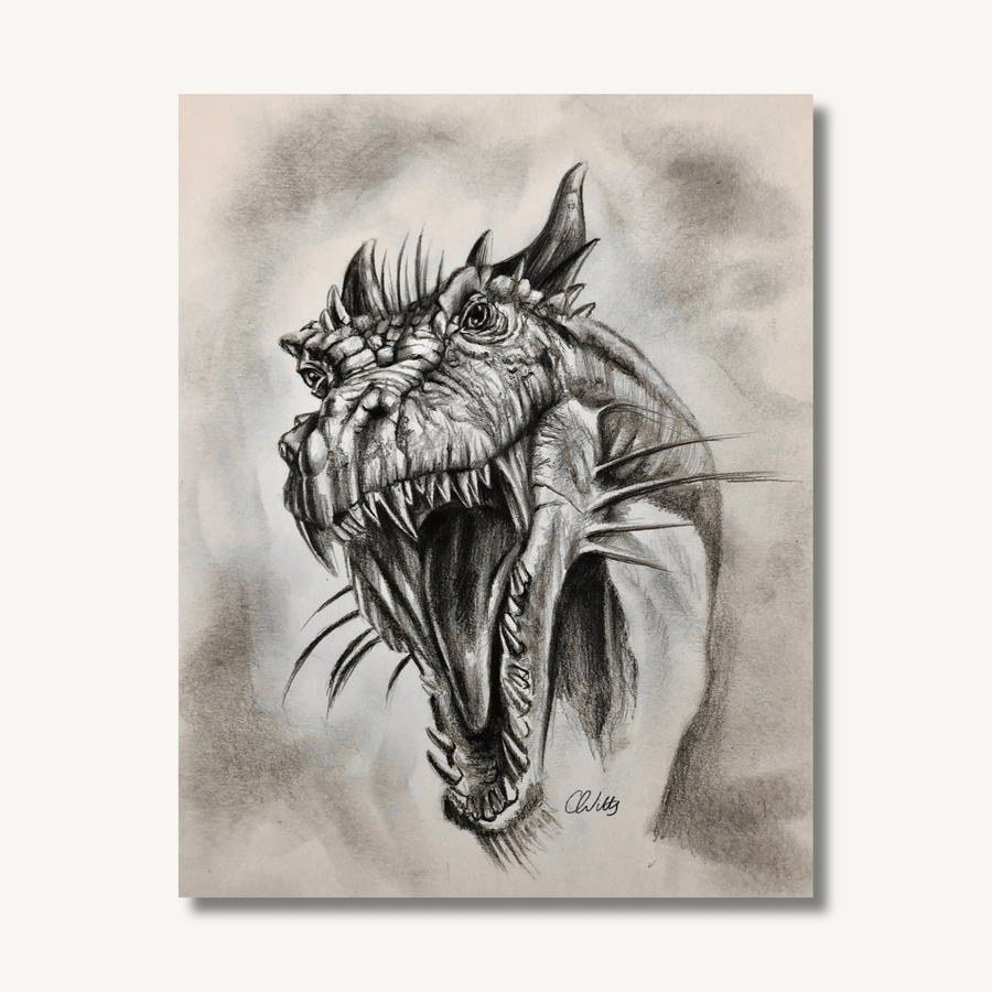 Detailed charcoal drawing of a dragon’s head with mouth open - looking menacing.