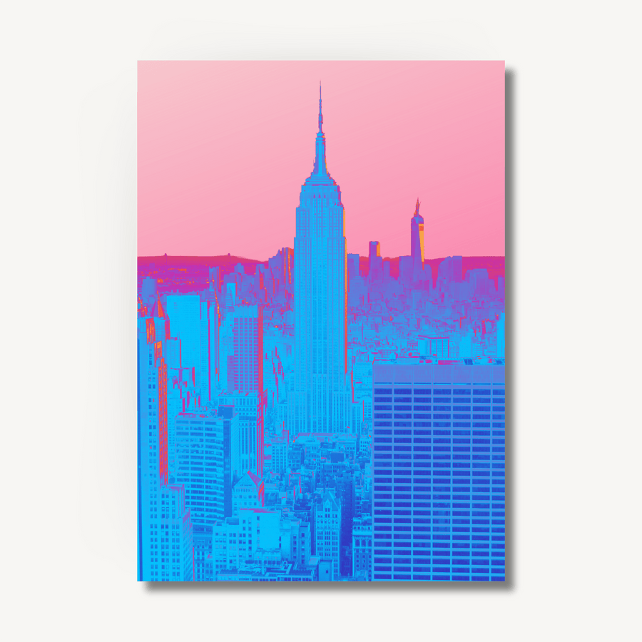 Hyper colourful, experimental photography print of New York City in neon blue and pink, set against a faded pink sky. Image on an off white background with a drop shadow to show that it’s an art print.