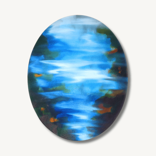 Beautiful, ethereal, abstract oil painting on a small oval canvas. The painting, while abstract, is painted with blue, white and green tones in a way that looks like light rippling gently on the surface of water.